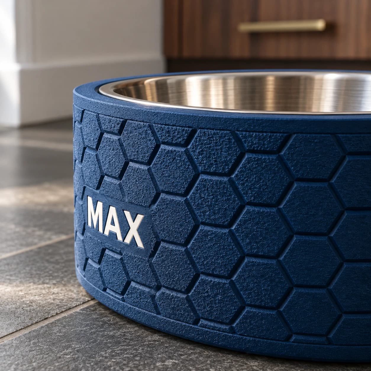 Close-up of a navy honeycomb stand showing its fuzzy-skin texture and crisp ivory MAX lettering